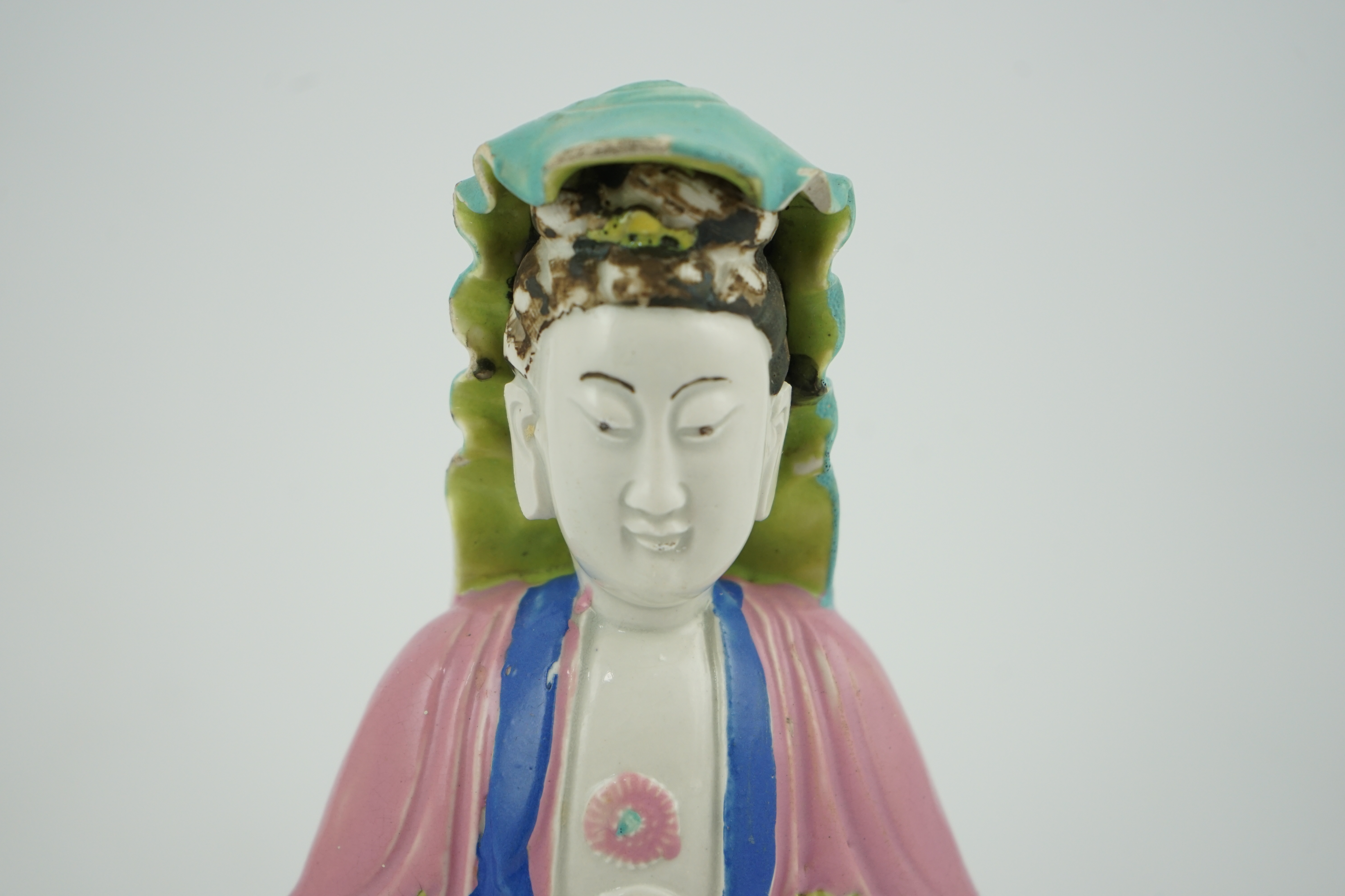 A Chinese Dehua polychrome enamelled blanc de chine figure of Guanyin, late 18th century